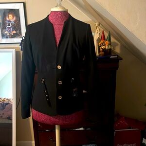 New without tags. Calvin Klein size 2 blazer with belt detail.